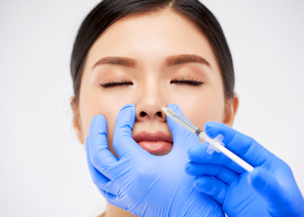 featured woman having an anesthesia injection on her nose