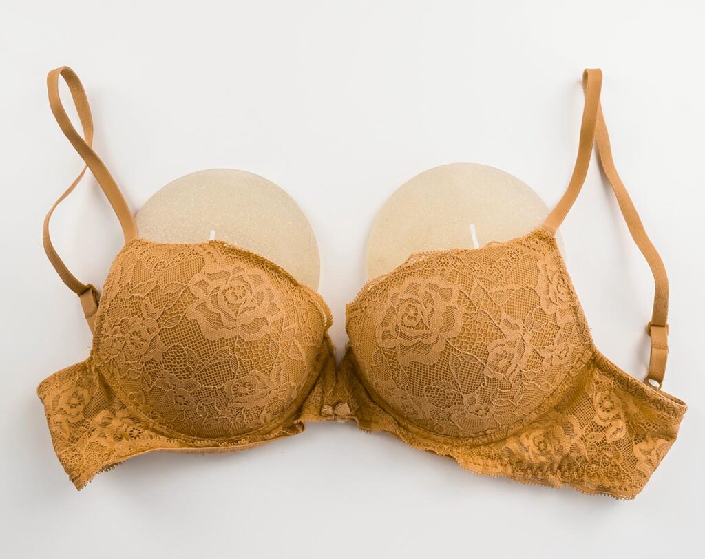 yellow bra with silicone breast implants