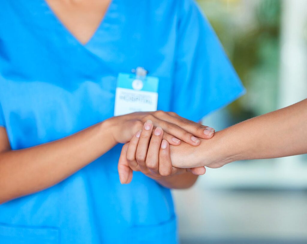 nurse holding hand for customer care