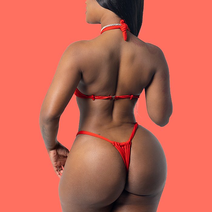 woman with brazilian butt lift with red bathing suit